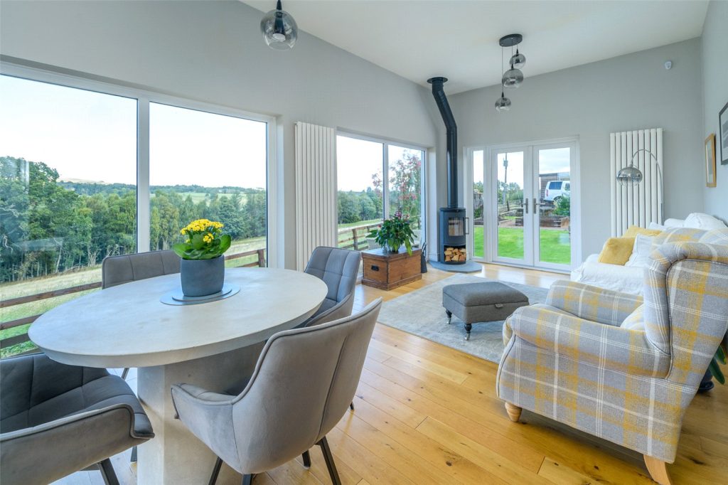 The bright living and dining area with garden views